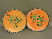 Lot 665 - Two Carlton Ware orange lustre chargers