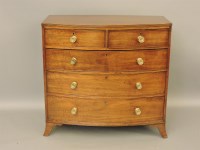 Lot 766 - A Georgian mahogany bow front chest of drawers