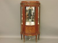 Lot 767 - A late 20th century French style bow fronted vitrine