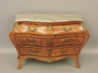 Lot 843 - A reproduction French bombe form three drawer commode