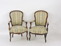 Lot 855 - A pair of Victorian rosewood framed open armchairs