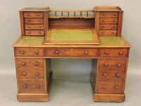 Lot 857 - A 19th century mahogany Dickens style desk