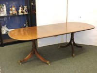 Lot 883 - A Regency style mahogany twin pedestal dining table