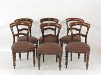 Lot 884 - A set of six Victorian mahogany balloon back dining chairs