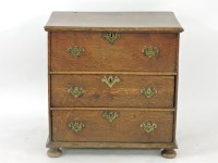 Lot 837 - An 18th century oak three drawer chest