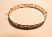 Lot 298 - A 9ct gold rose gold pierced bangle