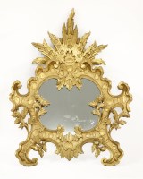 Lot 611 - An Italian baroque-style carved wood wall mirror