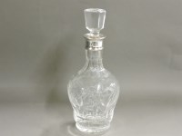 Lot 662 - A silver mounted cut glass and etched decanter