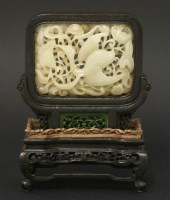 Lot 97 - A deeply-carved jade Plaque