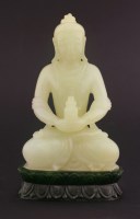 Lot 104 - A jade Buddha