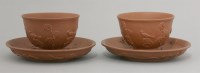 Lot 50 - A rare pair of Yixing Tea Bowls and Saucers