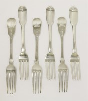 Lot 117 - A matched set of six George III silver fiddle pattern table forks