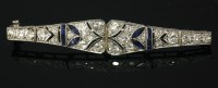 Lot 460 - An Art Deco diamond and sapphire bar brooch