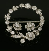 Lot 462 - A diamond set floral wreath brooch