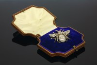 Lot 342 - A cased late Victorian diamond and ruby bee brooch