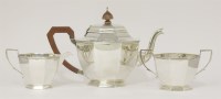 Lot 153 - A silver three piece tea set