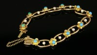 Lot 406 - An Edwardian turquoise and split pearl gold chain bracelet