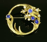 Lot 558 - An 18ct gold sapphire and diamond set circle spray brooch