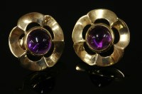 Lot 565 - A pair of 9ct gold cabochon amethyst earrings