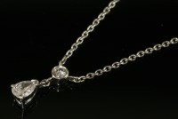 Lot 575 - A platinum two stone diamond pendant