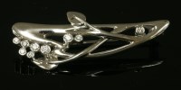 Lot 585 - An 18ct white gold diamond set Art Nouveau-style brooch