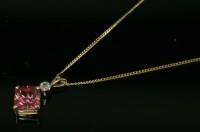 Lot 601 - An 18ct yellow and white gold pink tourmaline and diamond pendant