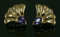 Lot 608 - A pair of 9ct gold tanzanite and diamond clamshell shaped stud earrings