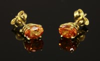 Lot 610 - A pair of 18ct gold single stone mandarin garnet stud earrings