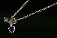 Lot 621 - An 18ct white gold blue topaz and iolite crossover slide pendant