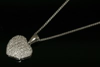 Lot 625 - A 9ct white gold diamond set heart pendant