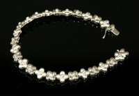 Lot 628 - An 18ct white gold diamond set line bracelet