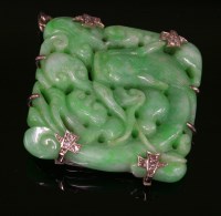 Lot 452 - An Art Deco carved jade plaque brooch/pendant