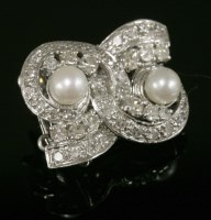 Lot 523 - An 18ct white gold two row cultured pearl and diamond clasp