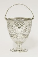 Lot 70 - A George III silver swing-handled sugar basket