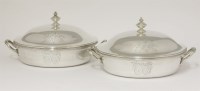 Lot 129 - A pair of George III silver two-handled vegetable dishes and covers