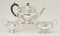 Lot 137 - A silver three-piece tea set
