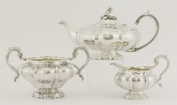 Lot 161 - A matching George IV/William IV silver three-piece melon shaped tea set