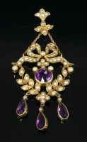 Lot 402 - An Edwardian amethyst and split pearl pendant