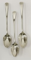 Lot 82 - Three George III silver old english pattern basting spoons