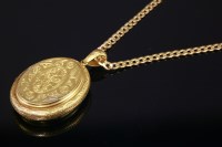 Lot 410 - A late Victorian gold oval hinged locket