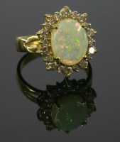 Lot 532 - An 18ct gold opal and diamond cluster ring