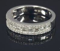 Lot 645 - An 18ct white gold diamond set half eternity ring