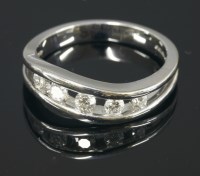 Lot 649 - An 18ct white gold diamond set crossover ring