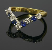 Lot 677 - An 18ct yellow and white gold sapphire and diamond half wishbone ring