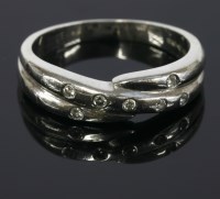 Lot 678 - A platinum diamond set band ring