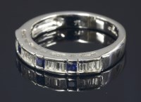 Lot 682 - An 18ct white gold sapphire and diamond half eternity ring