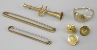 Lot 1067 - Two gold bar brooches