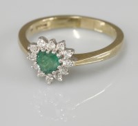 Lot 1013 - A 9ct gold heart shaped emerald and diamond cluster ring
