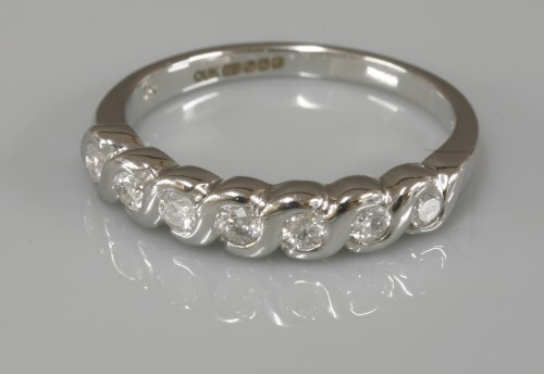 Lot 1045 - A 9ct white gold diamond set half eternity ring