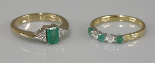 Lot 1020 - A 9ct gold emerald and diamond seven stone lozenge shaped ring